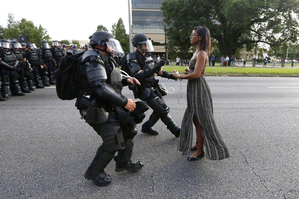 A demonstrator protesting the shooting death of Alton Sterling is detained by law enforcement near the headquarters of the Baton Rouge Police Department in Baton Rouge, Louisiana, USA, 9 July 2016.