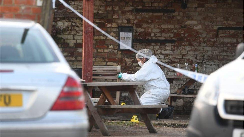 Forensic officer outside the pub