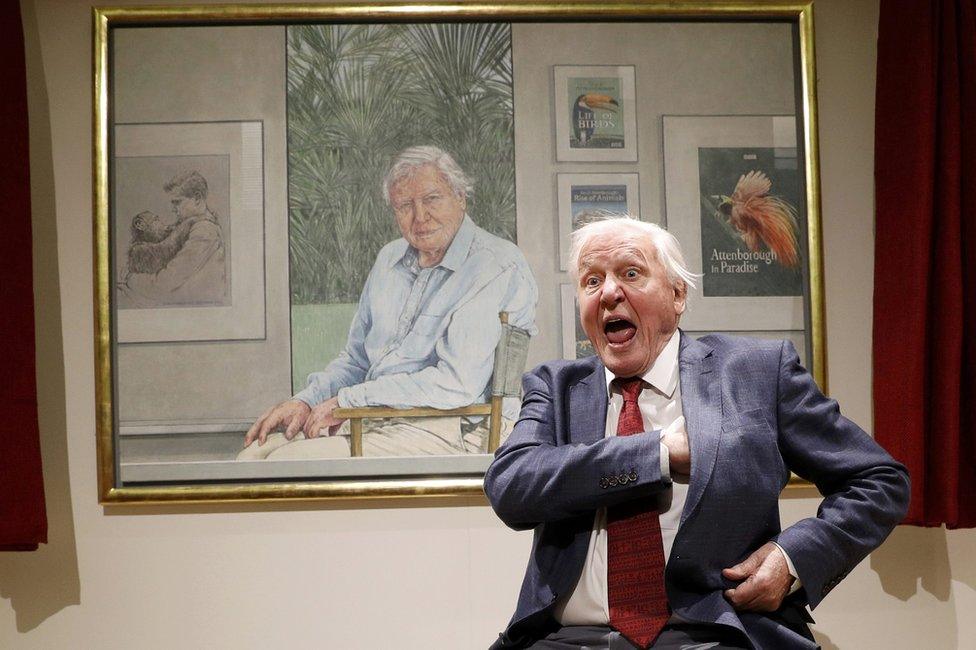 Sir David Attenborough in front of his portrait