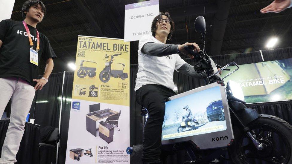 Man sitting on e-bike in convention