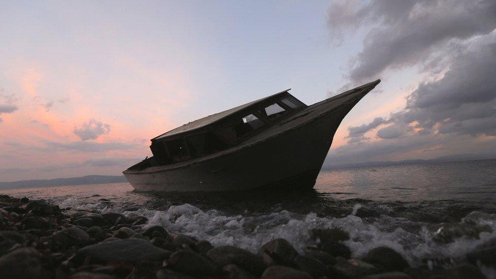 File photo of a boat used by refugees and migrants on a beach in Lesbos