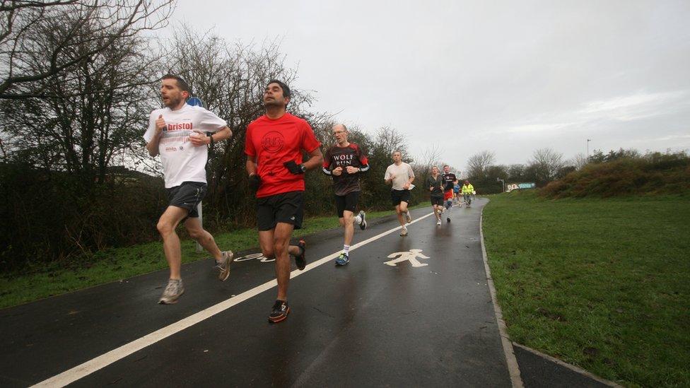 Runners in Little Stoke Park near Bristol