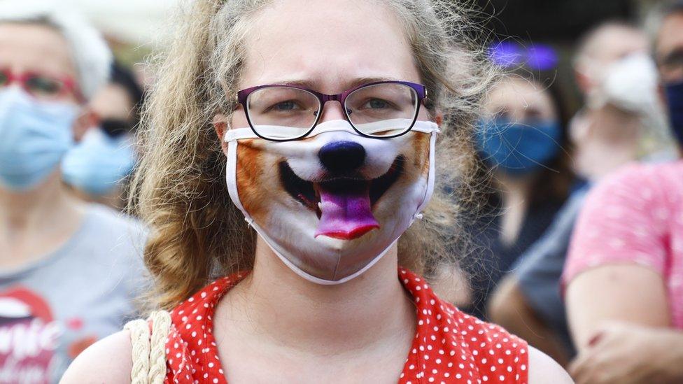 Girl wearing dog themed facemask