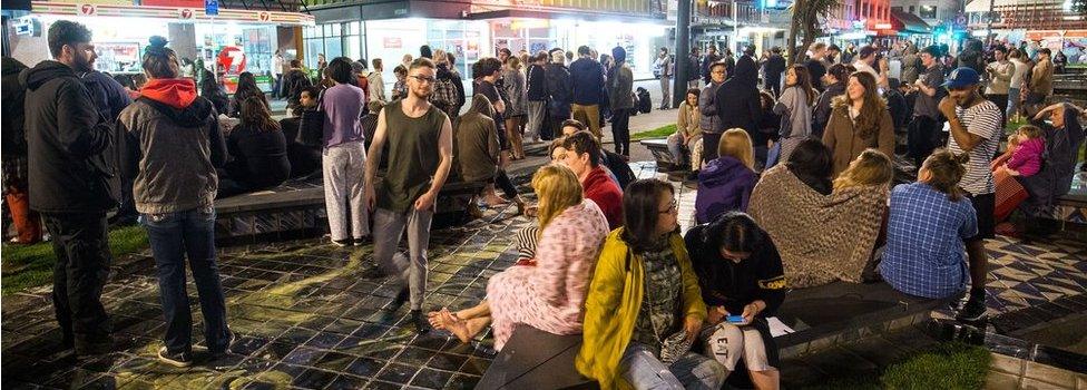 People wait in Te Aro Park after being evacuated from nearby buildings following an earthquake on 14 November 2016 in Wellington, New Zealand