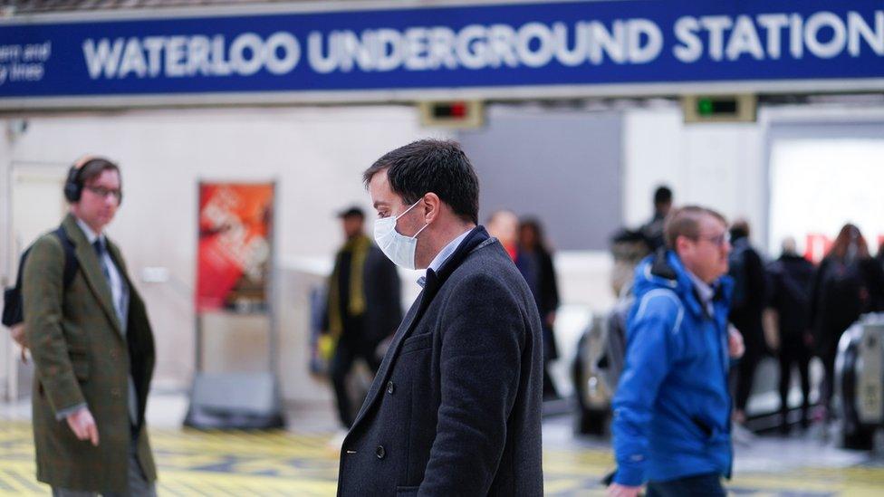 Man wearing mask on London Underground