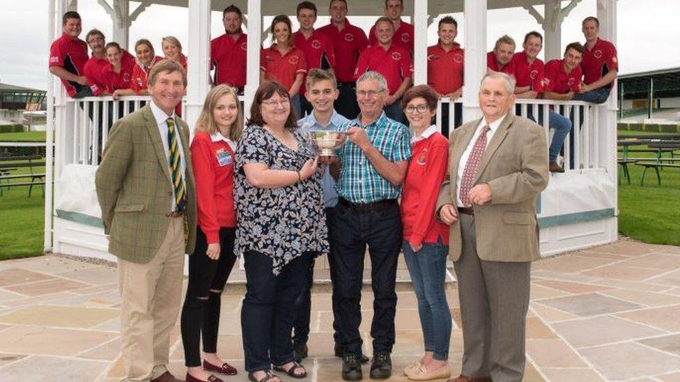 Michael Spink's family and friends with the trophy