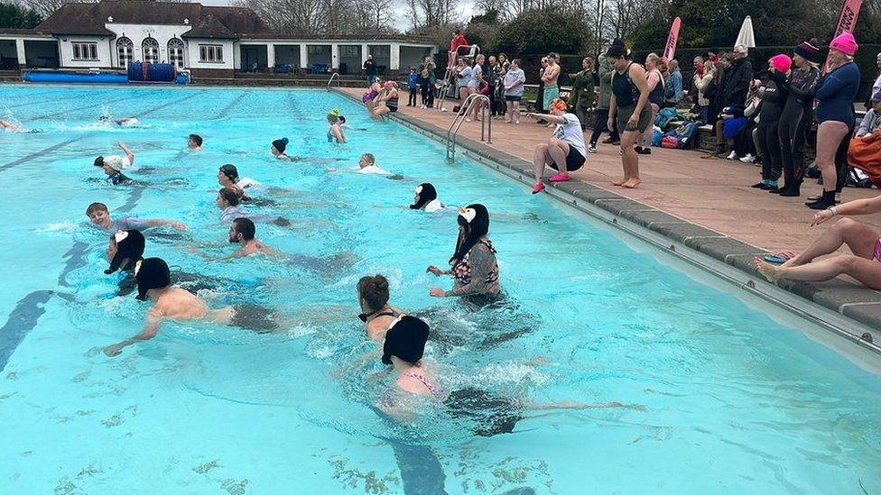 Swimmers braving the water