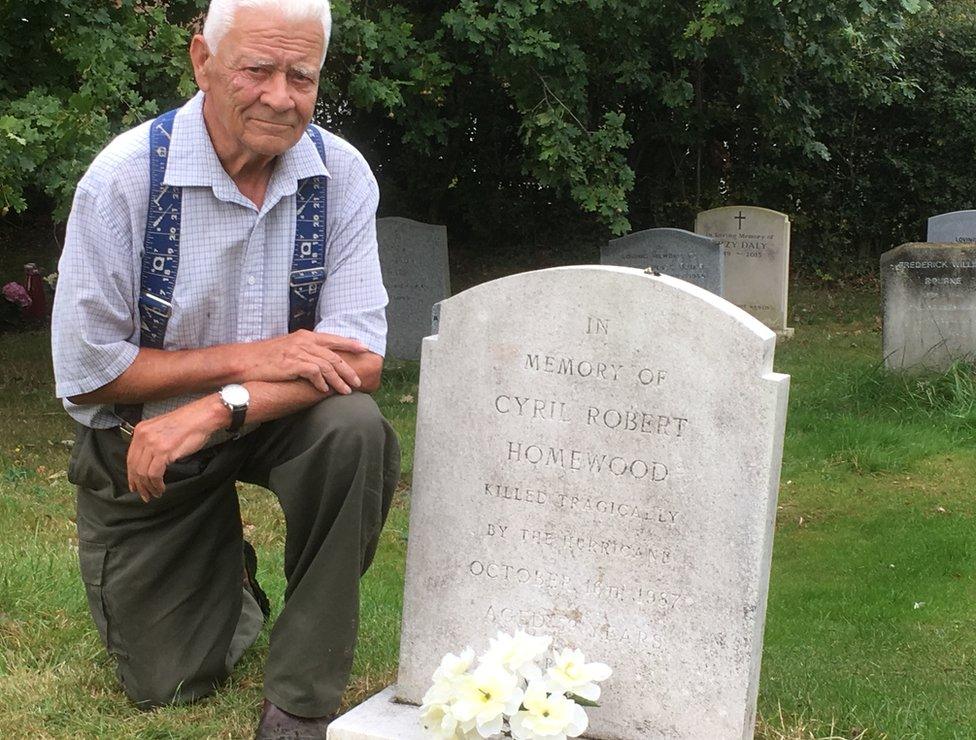 Alec Homewood next to his brother's grave