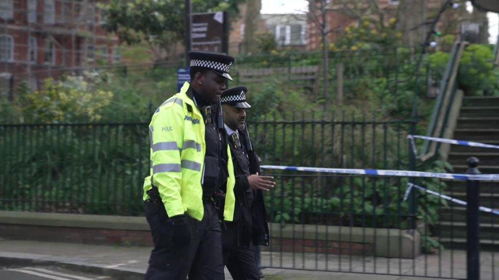 Police walking in Shoreditch.