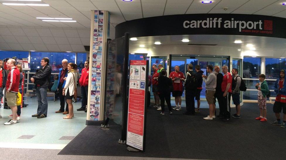 Wales fans at Cardiff Airport on Saturday morning