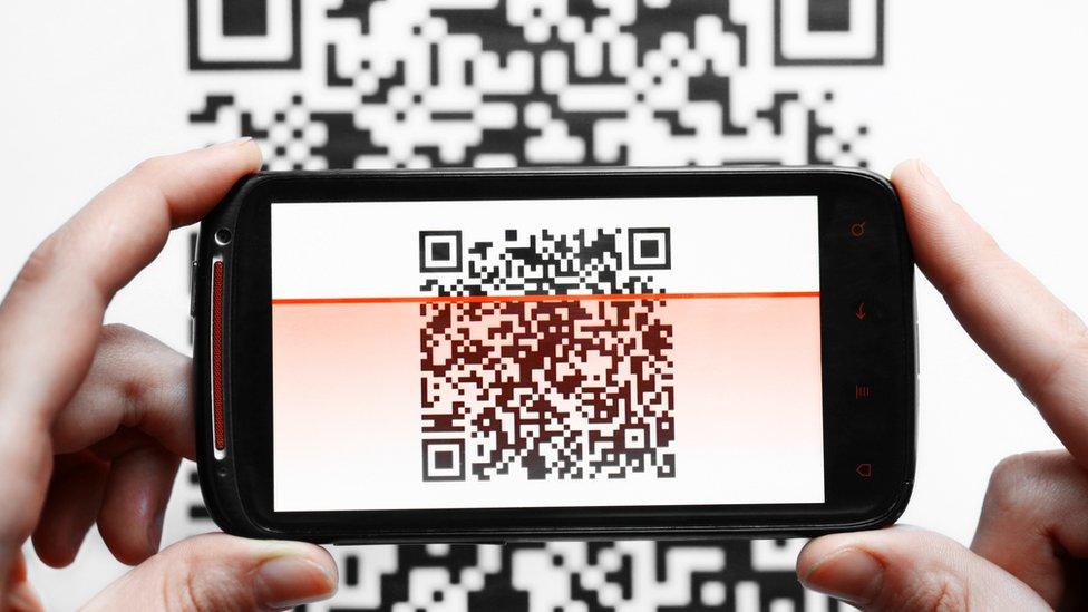 QR code being scanned