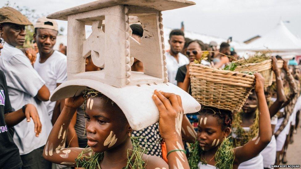 Members of Chale Wote Kids City perform a Homowo harvest festival Ritual on Accra's High Street, as part of the Chale Wote Street Art Festival, 2015