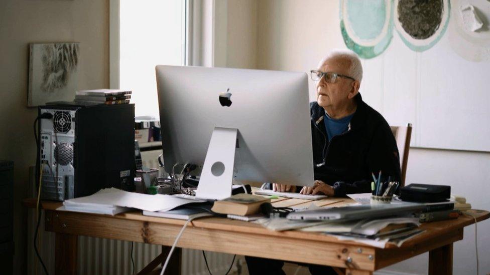 Andrew Davies at his computer working