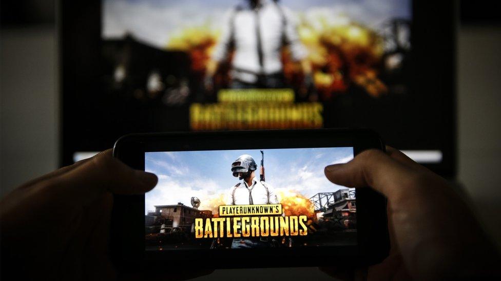 A man plays PUBG game on smartphone in Ankara, Turkey on November 26, 2018