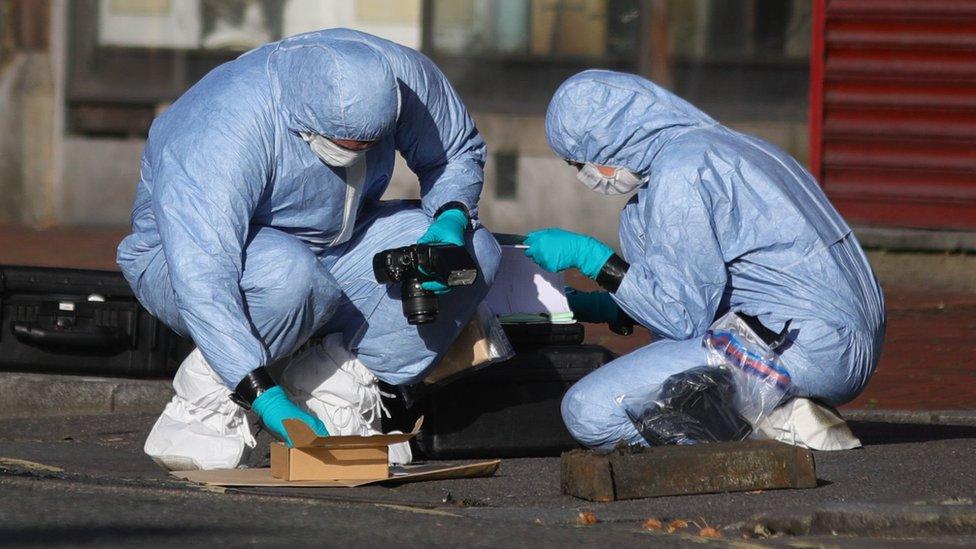 Forensic officers work near Forbury Gardens, in Reading town centre