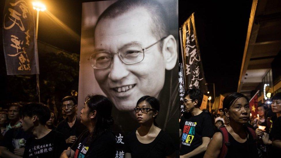 People attend a candlelight march for the late Chinese Nobel laureate Liu Xiaobo in Hong Kong on July 15, 2017.