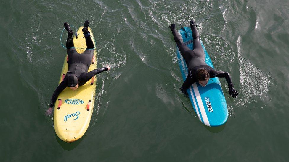 Two paddle boarders off Boscombe beach, Dorset