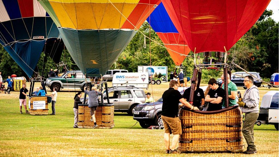 Hot air balloons preparing to take flight