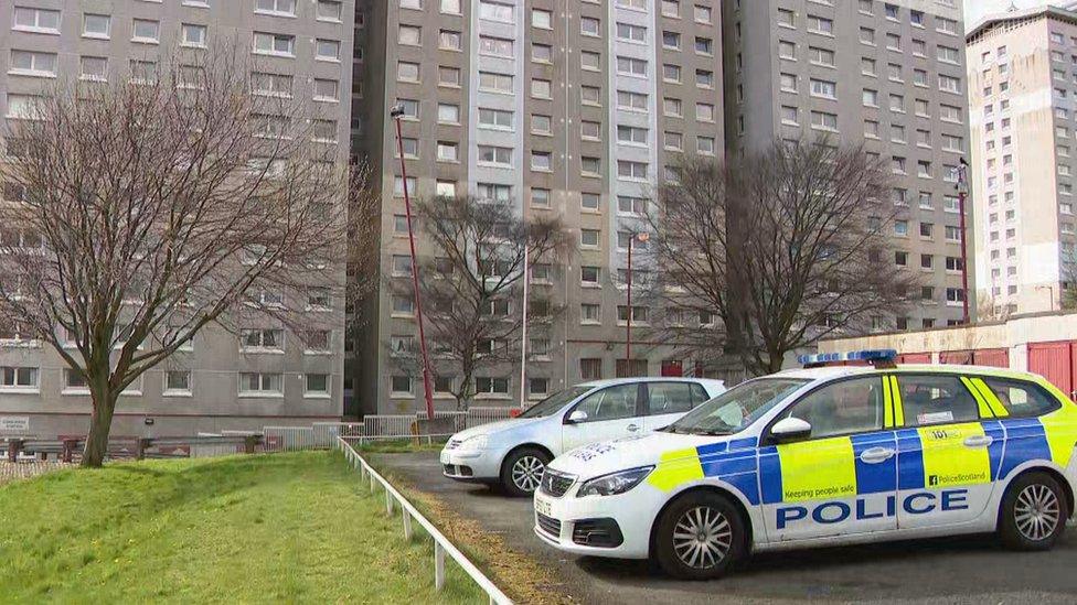 Police outside the High Coats Flats in Coatbridge