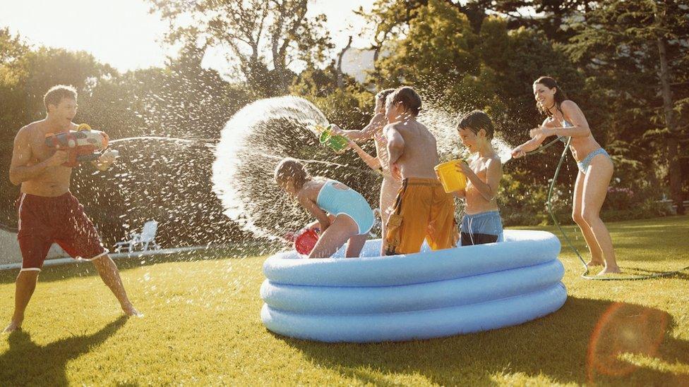 family have a water fight