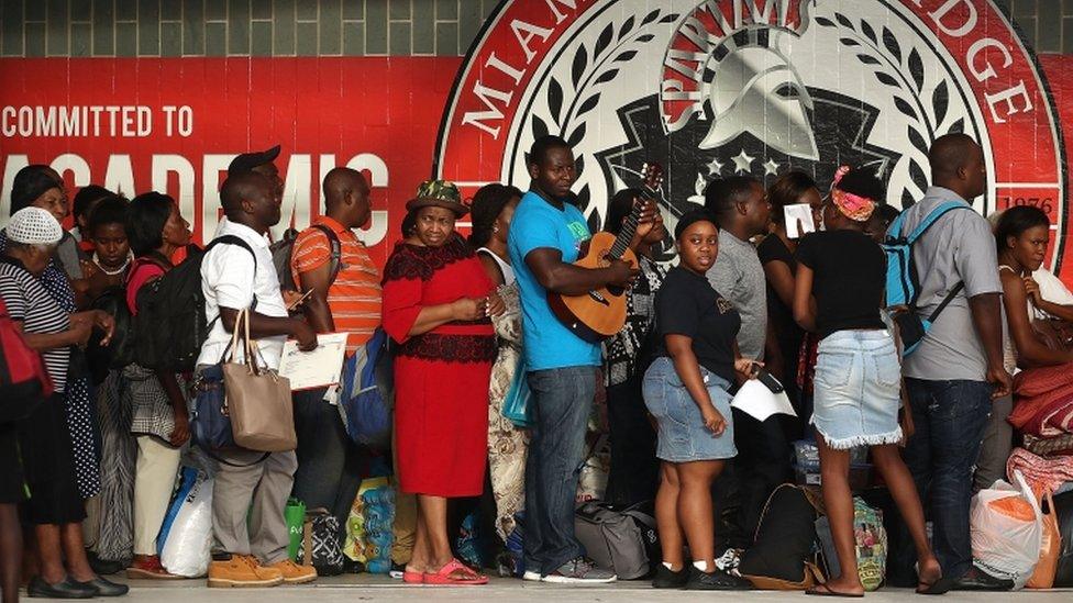 People wait to enter South Ridge high school in Miami