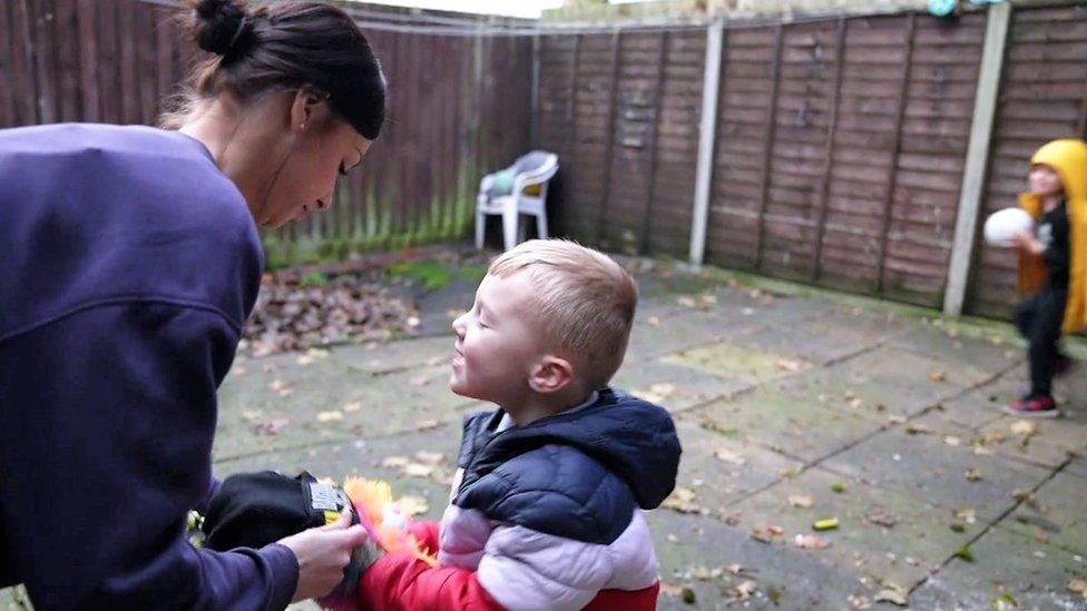 Charlotte Chapman playing with her children