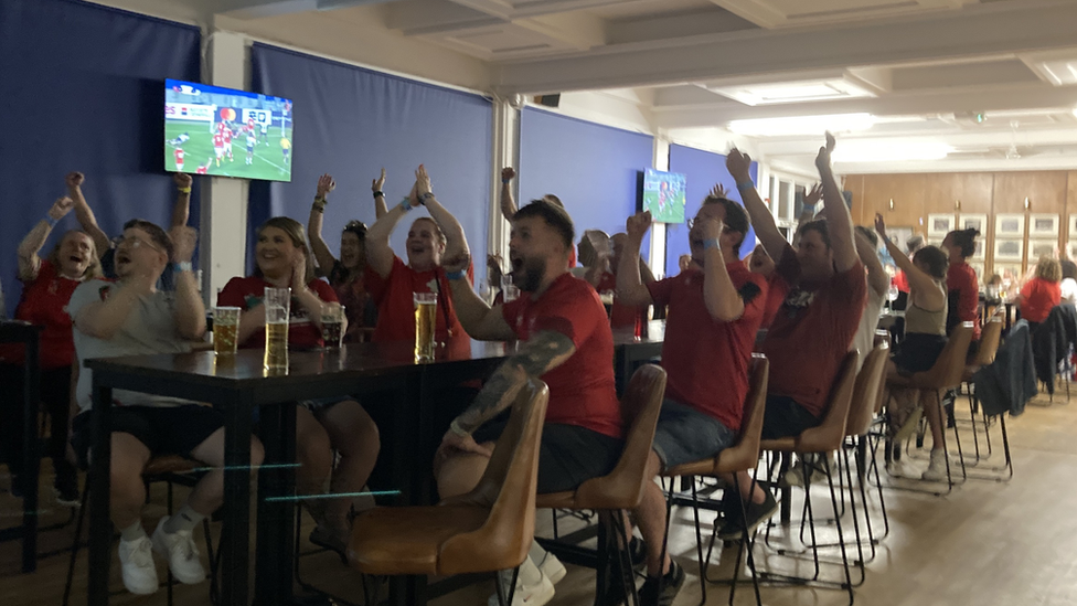 Fans celebrate Wales' first try at Cardiff Arms Park