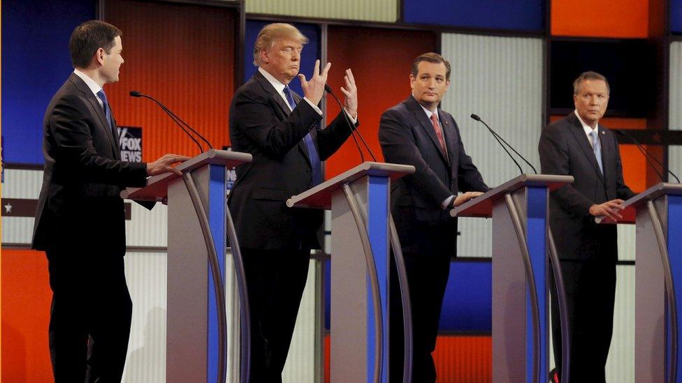 Donald Trump looks at his hands at the Fox debate