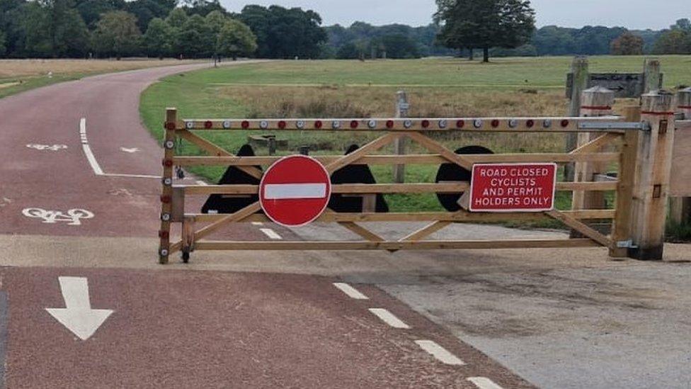 Gate in Richmond Park with a sign saying only permit holders were allowed