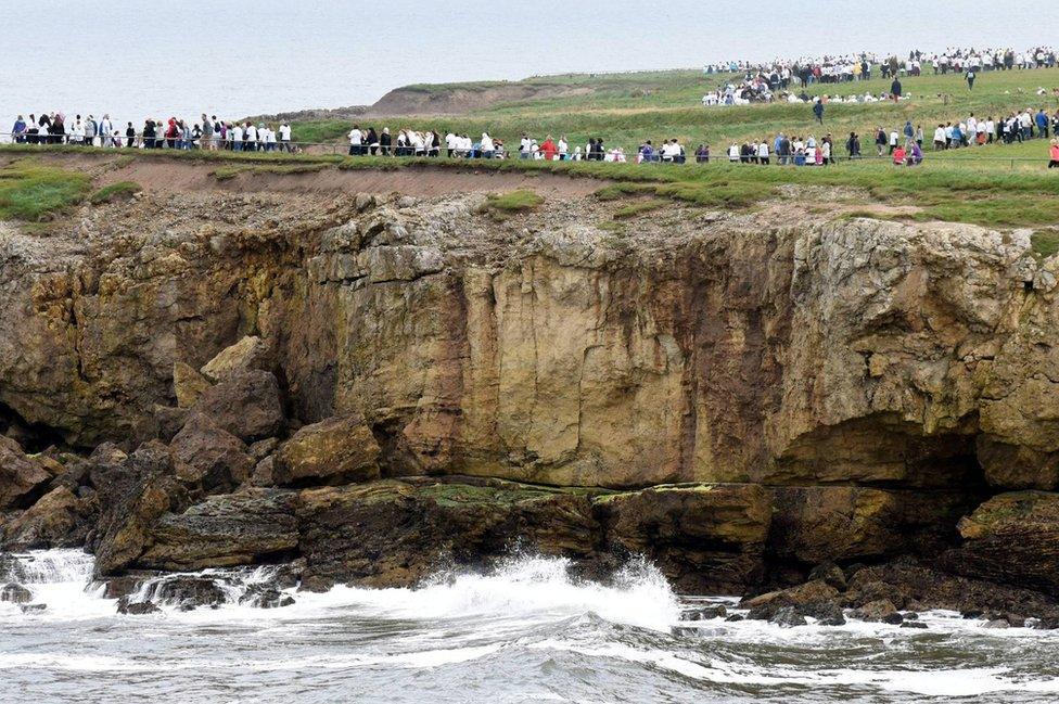 Thousands of walkers make their way along the coastal route