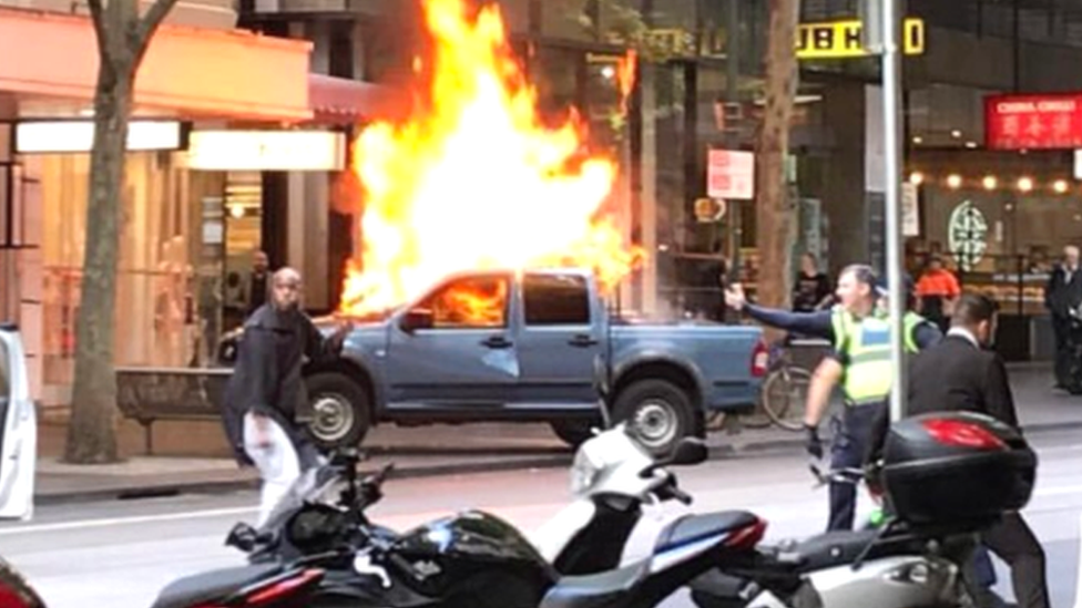 A car on fire at Bourke street