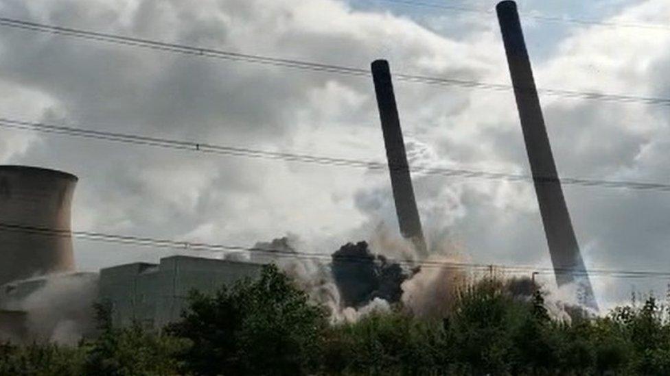 Still from towers being demolished