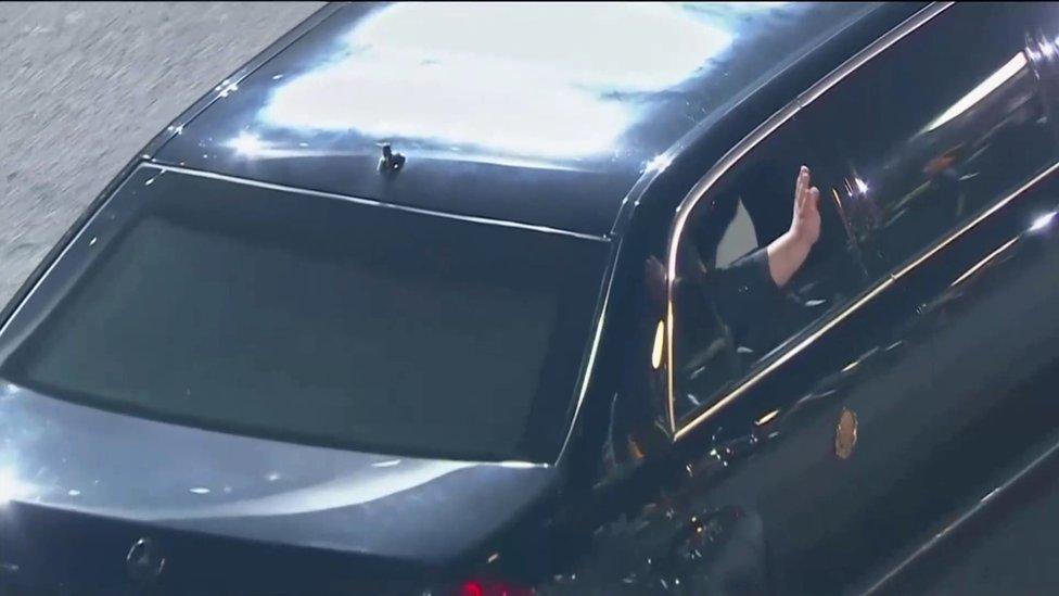 Mr Kim waves as he returns to North Korea