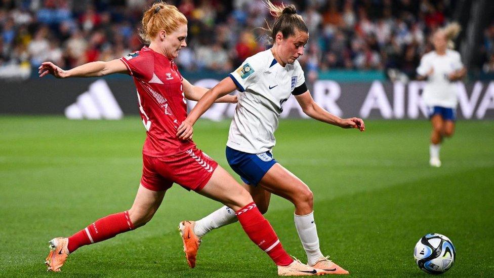 Stine Ballisager of Denmark (left) fights for the ball with Ella Toone of England