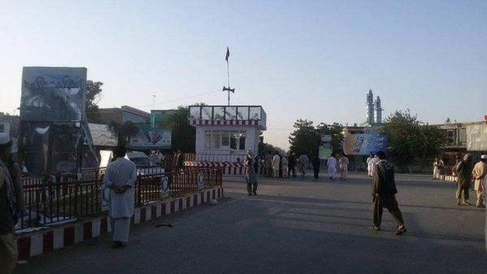 A roundabout, with the Afghan flag flying in the middle