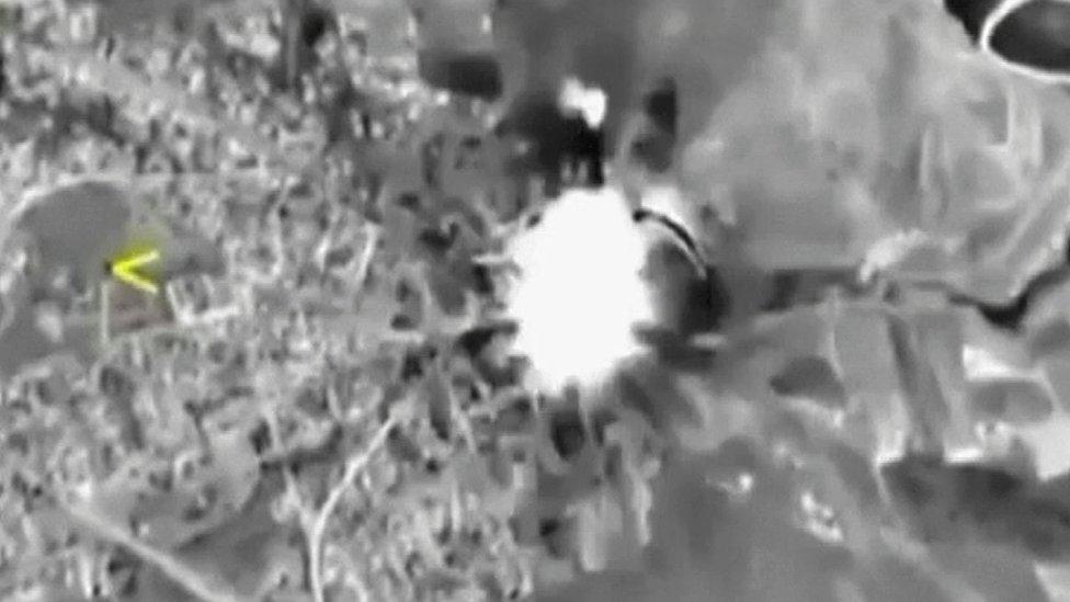 A frame grab taken from video released by the Russian Defence Ministry October 1, 2015, shows Russian jets hitting a target in Syria