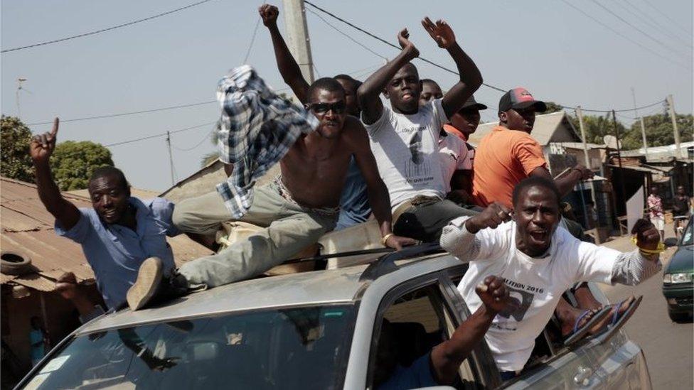 Gambians celebrate the victory of opposition coalition candidate Adama Barrow in the streets of Serrekunda, Gambia,on 2 December 2016