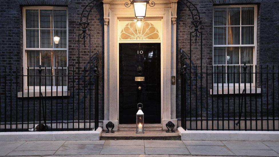 Prime Minister Boris Johnson's official Twitter account shared a photo of a candle lit outside the front door of No 10 Downing Street