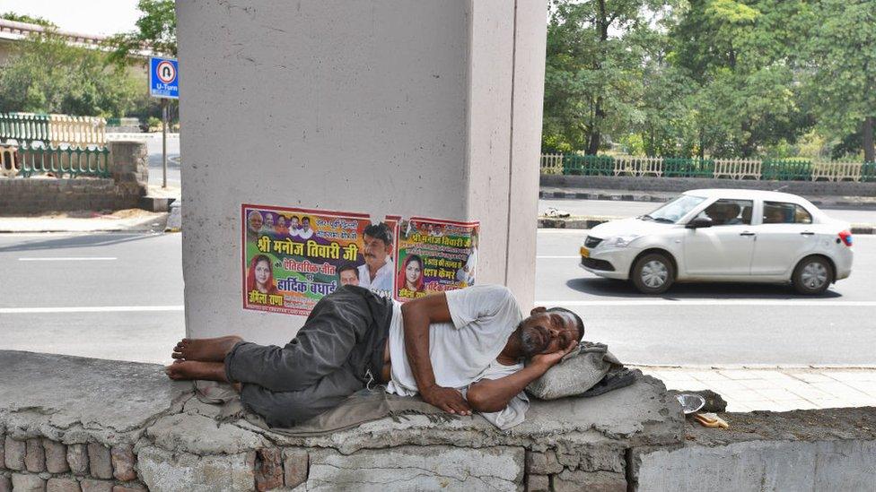 A homeless man takes an afternoon nap under a flyover on a hot day near Nigambodh Ghat as temperature rises above 45 degree celsius, on June 2, 2019.