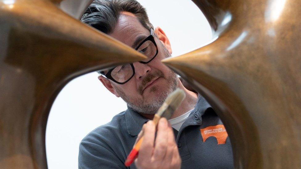 Sculpture conservator James Copper waxing "Working Model for Oval with Points" which forms part of the new exhibition "Henry Moore: The Sixties" at the Henry Moore Studios and Gardens in Much Hadham, Hertfordshire