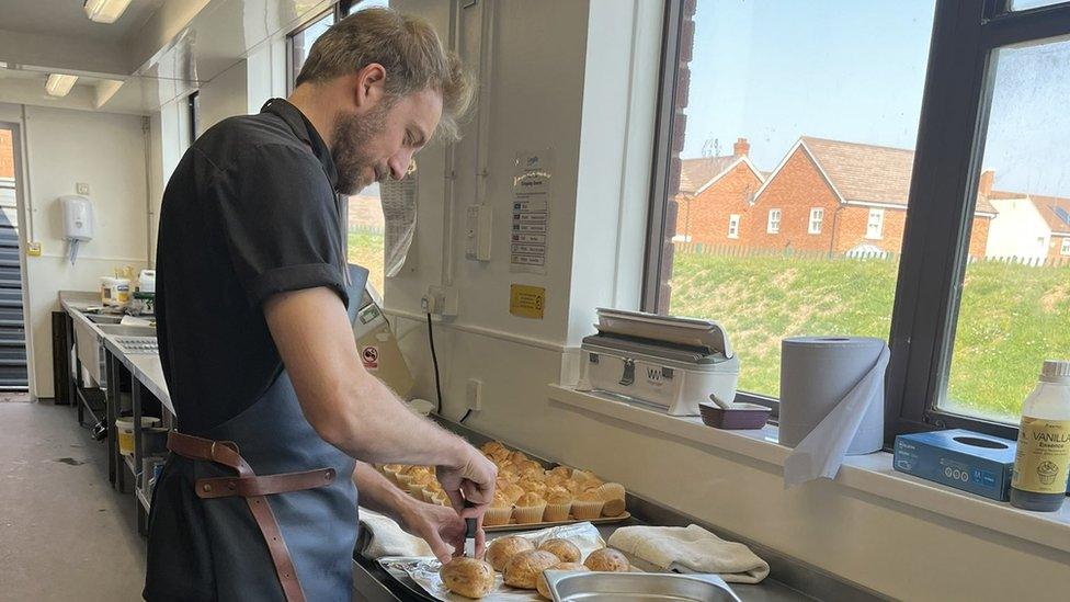 Chef Rob Roy Cameron cooking in a school kitchen