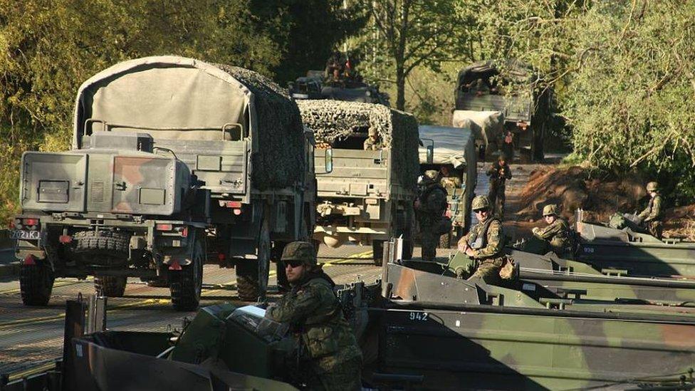 Estonian and allied troops take part in a river crossing exercise