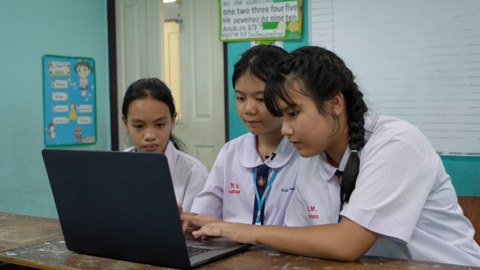 Children in Thailand watching videos with conspiracy theories