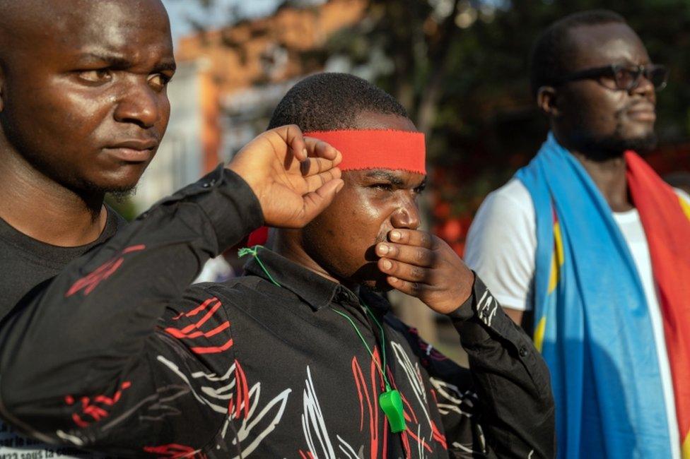 Mourners take part in a vigil to commemorate last week's attack on displaced people camps in Goma.