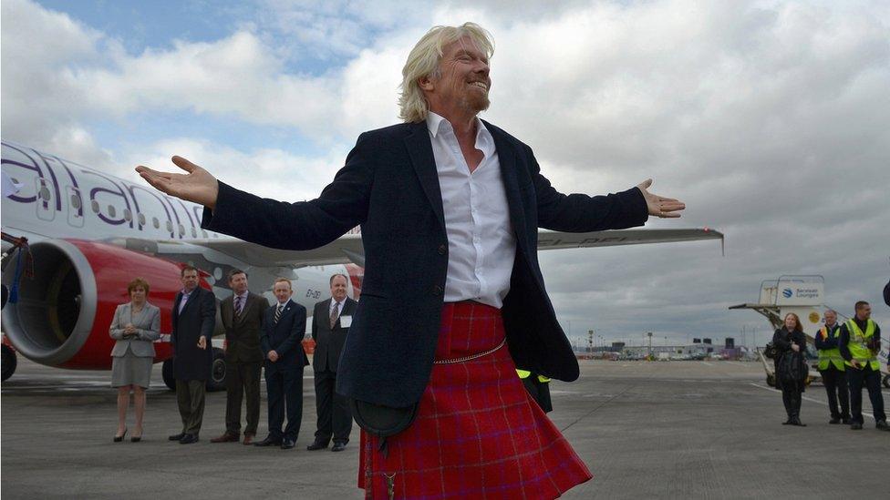 Sir Richard Branson arrives in Edinburgh Airport on April 8, 2013 in Edinburgh, Scotland. He arrived aboard the inaugural Virgin Atlantic Little Red flight.