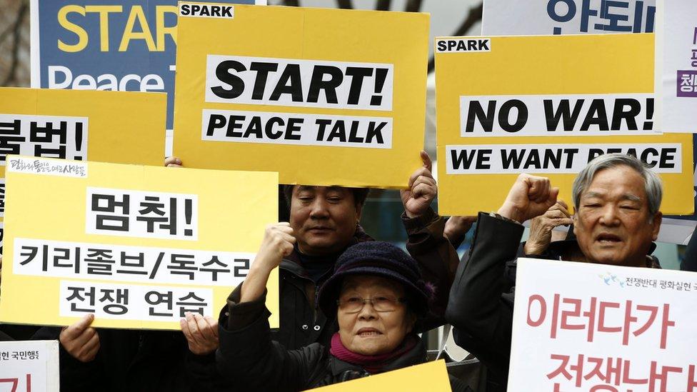 South Korean protesters shout slogans such as "Stop War Exercises and Start Peace Talks" during a rally against the exercises, in Seoul