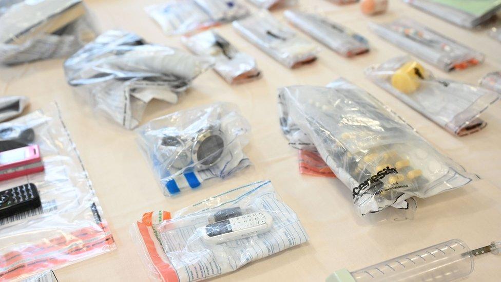 A selection of drugs and mobile phones discovered by search dogs in Maghaberry Prison