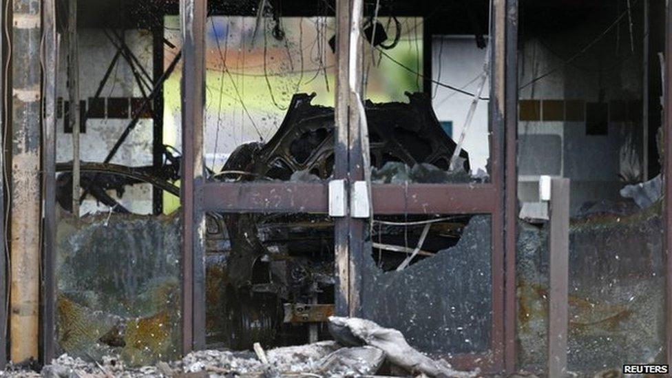 A burnt out car in the council building