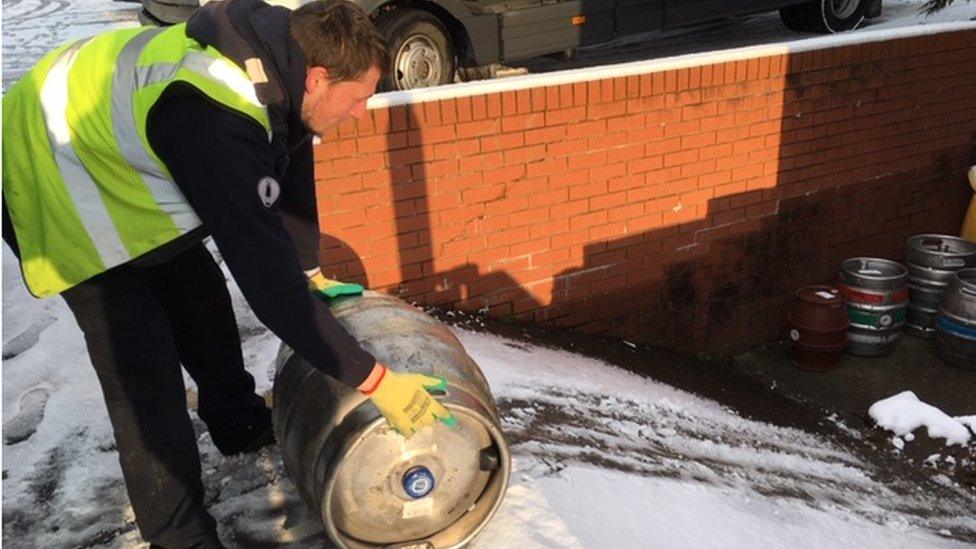 A man delivering beer