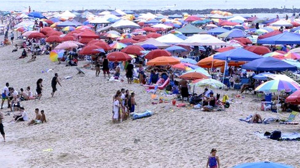 Bathers at the beach in Ocean City, Maryland, 22 July 2017